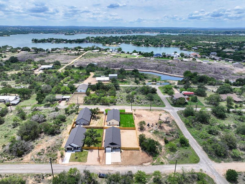 Aerial view of property's location with a nearby body of water and property boundaries highlighted