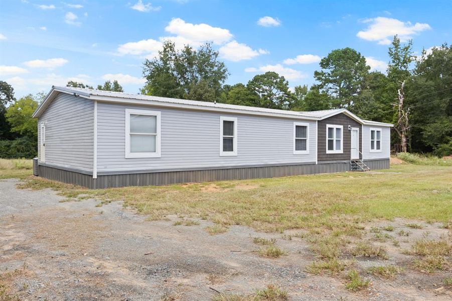 Front exterior of a new home in , Mount Pleasant, TX, highlighting curb appeal (Image 2).