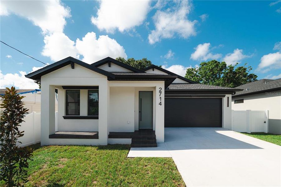 Front exterior of a new home in , Tampa, FL, highlighting curb appeal (Image 1). Front exterior of a new home in , Tampa, FL, highlighting curb appeal (Image 1).