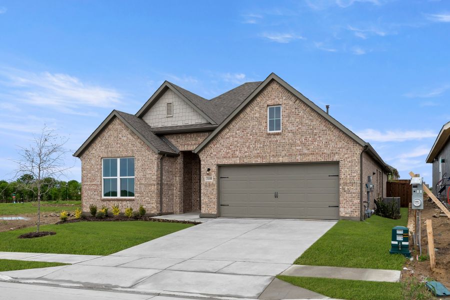Front exterior of a new home in Walden Pond, Forney, TX, highlighting curb appeal (Image 1). Front exterior of a new home in Walden Pond, Forney, TX, highlighting curb appeal (Image 1).