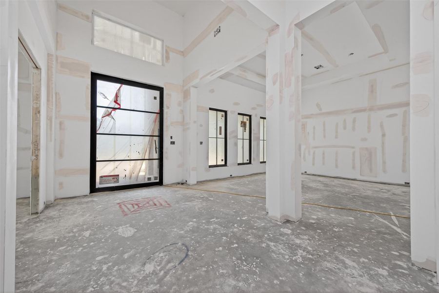 Grandiose entry with 18' ceilings and 6'x10' pivot hinge front door