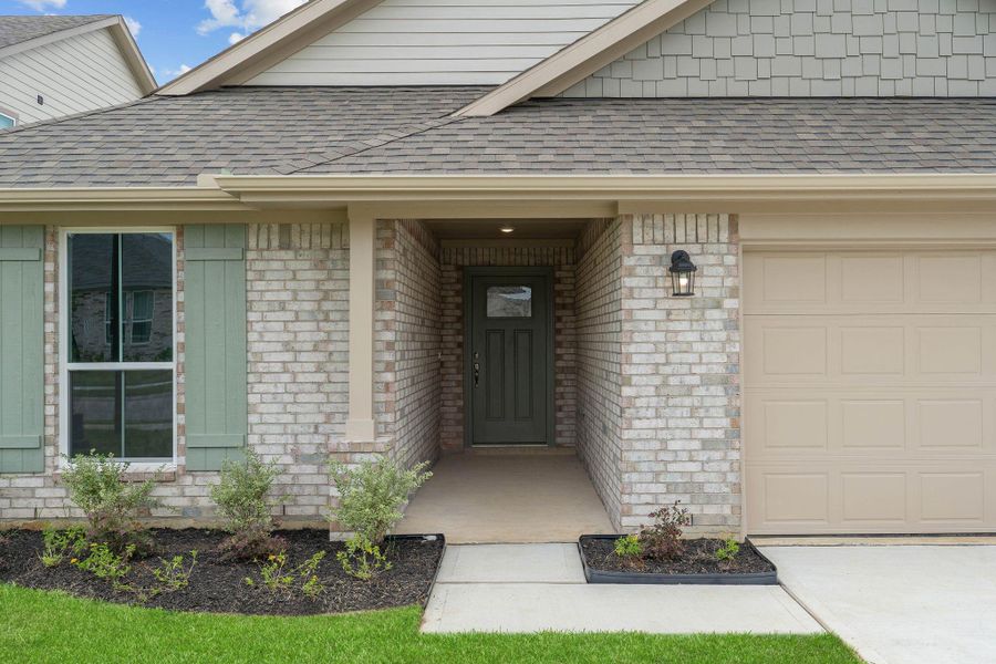 Front exterior of a new home in Grand Oaks Reserve, Cleveland, TX, highlighting curb appeal (Image 16).