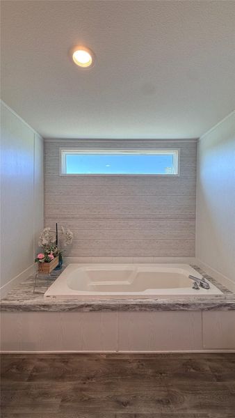 Relax in this inviting soaking tub, perfect for unwinding after a long day. Relax in this inviting soaking tub, perfect for unwinding after a long day.