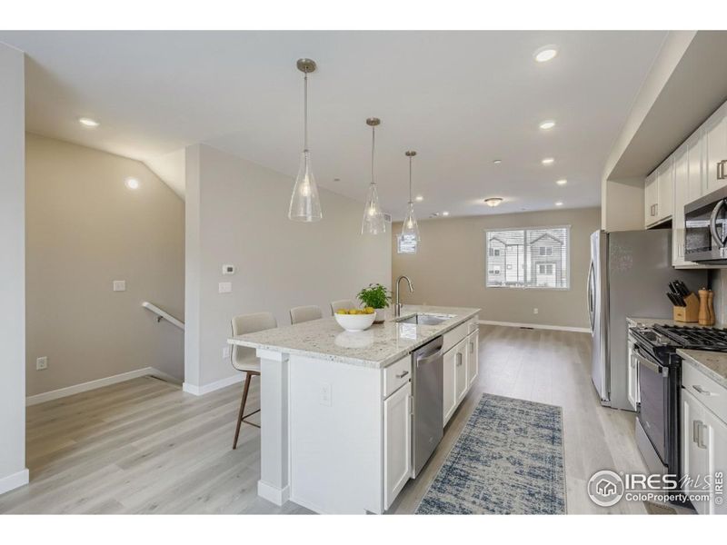Kitchen overlooking both the living room and dining area