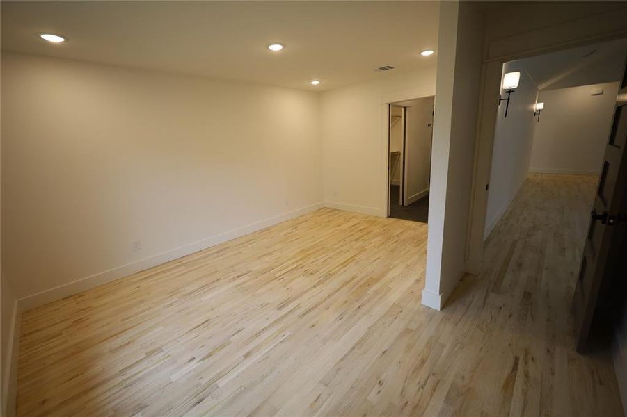 Unfurnished room featuring recessed lighting and light wood floors