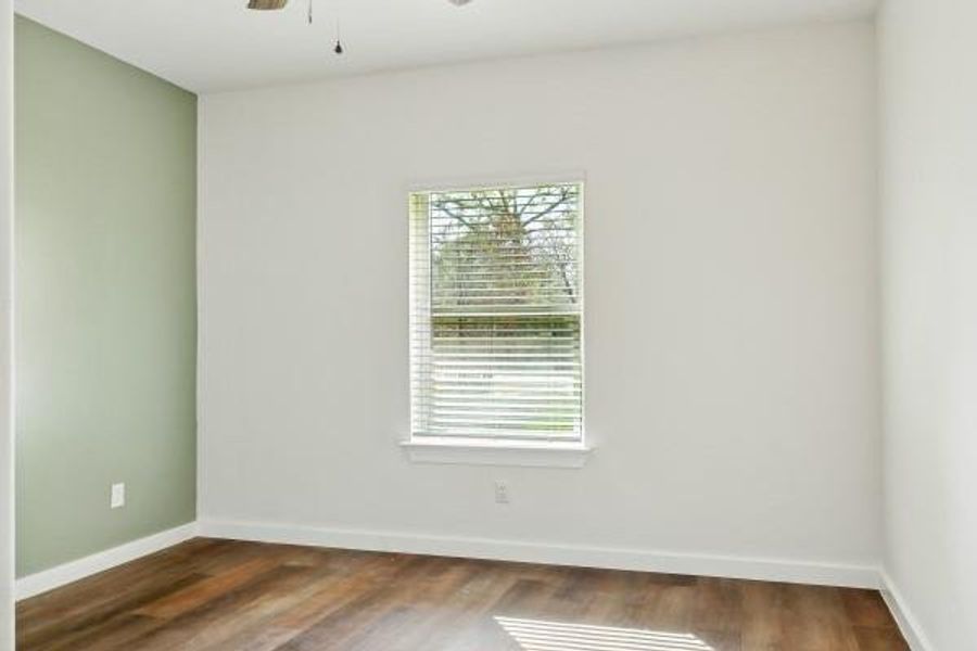 Bright and versatile third bedroom with stylish flooring and ample natural light. Bright and versatile third bedroom with stylish flooring and ample natural light.