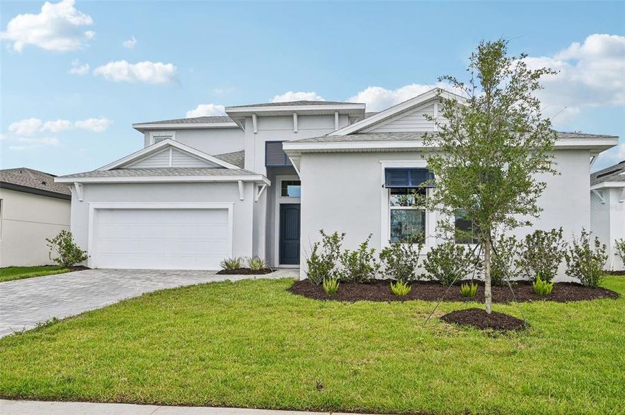 Front exterior of a new home in Biscayne Landing at Seaire, Parrish, FL, highlighting curb appeal (Image 19).