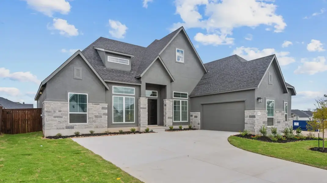 Representative exterior photo of a completed home built from the Ainsley by Chesmar Homes in Heimer Estates at Garden Ridge, Fulshear, TX (Image 18).