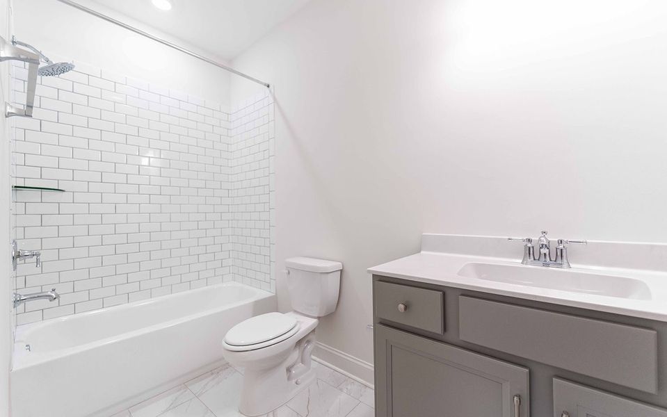 Furnished interior view inside a new home in Aden Woods, Fairview (Image 11).