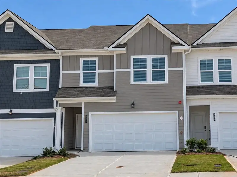 Front exterior of a new home in Walden Park – The Collection, Jonesboro, GA, highlighting curb appeal (Image 1). Front exterior of a new home in Walden Park – The Collection, Jonesboro, GA, highlighting curb appeal (Image 1).