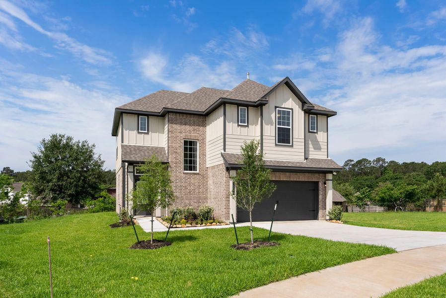 Front exterior of a new home in Spring Lake, Huntsville, TX, highlighting curb appeal (Image 1). Front exterior of a new home in Spring Lake, Huntsville, TX, highlighting curb appeal (Image 1).