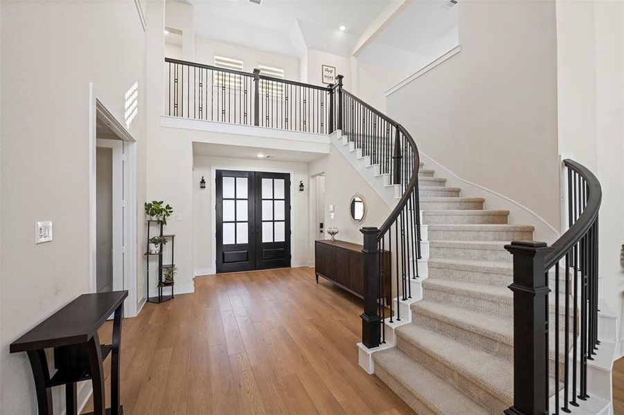 The beautiful curving stairway leads you to the 2nd floor!