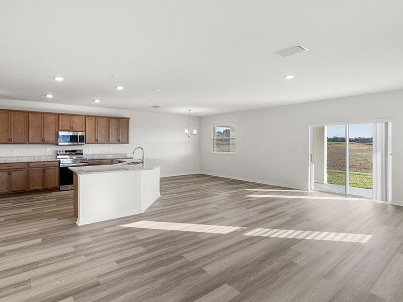 Enjoy a spacious, open living area with low-maintenance luxury vinyl plank flooring.