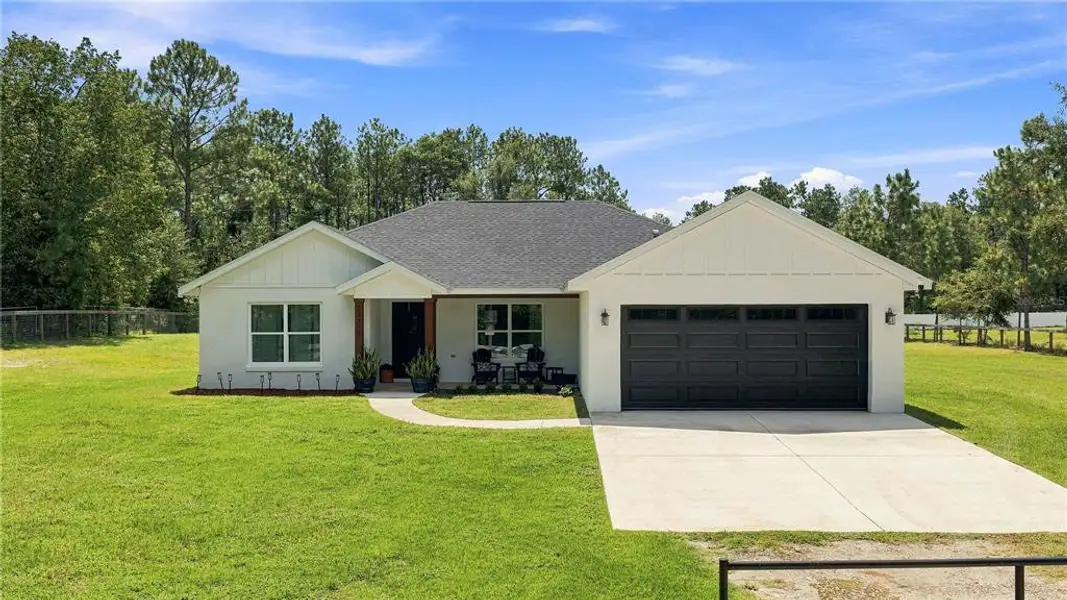 Front exterior of a new home in , Ocala, FL, highlighting curb appeal (Image 1). Front exterior of a new home in , Ocala, FL, highlighting curb appeal (Image 1).