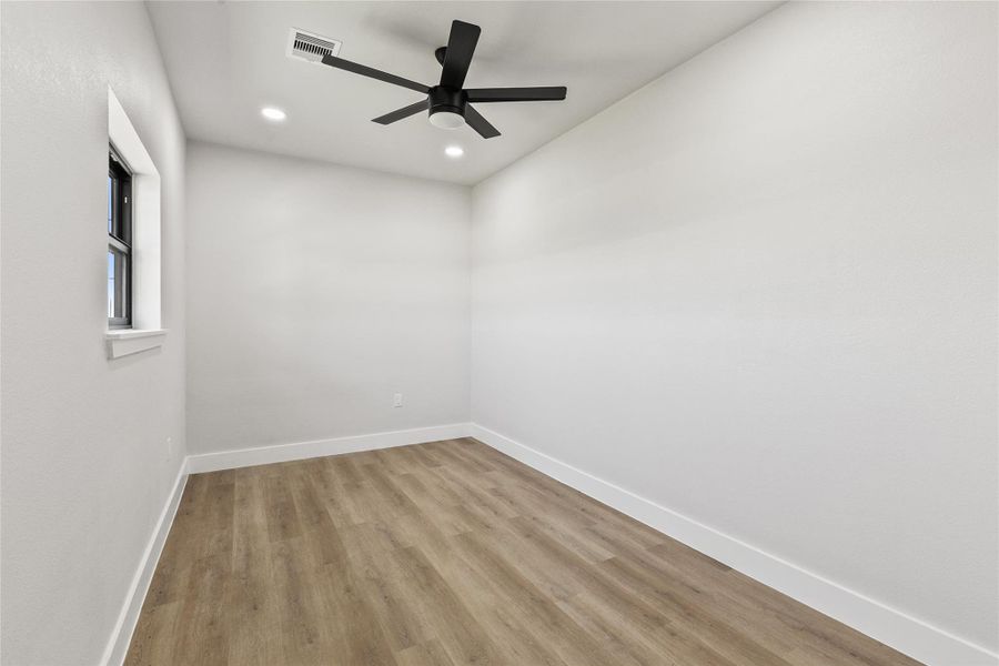 Dedicated home office conveniently located near the entryway and half bath, providing a quiet space for working from home, managing daily tasks, or pursuing hobbies.