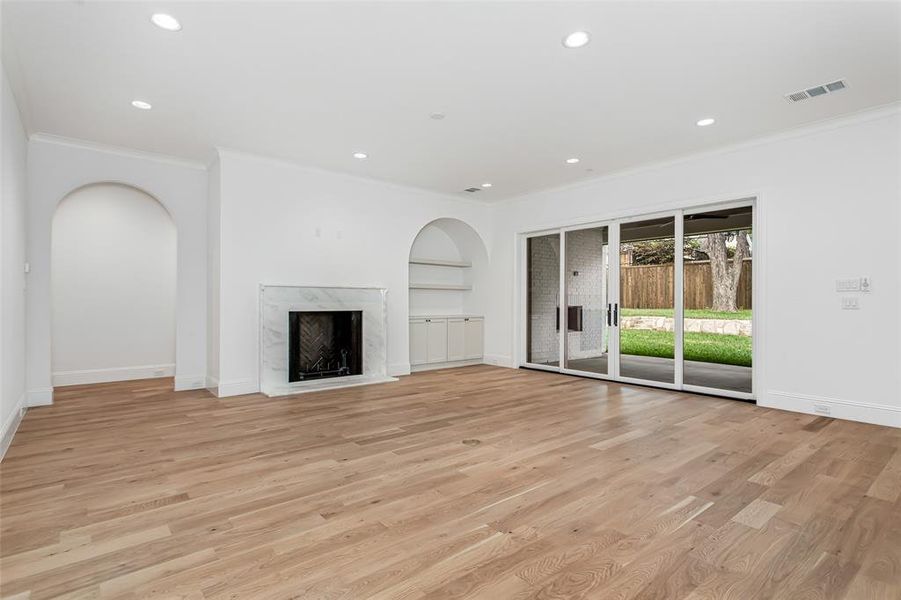 Fireplace and view of backyard