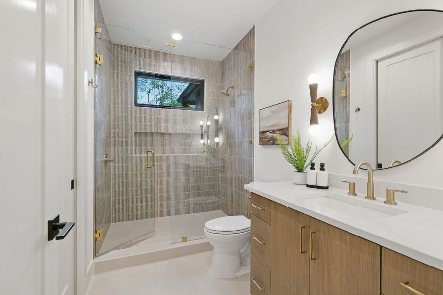 Bathroom featuring vanity, a stall shower, and tile patterned floors
