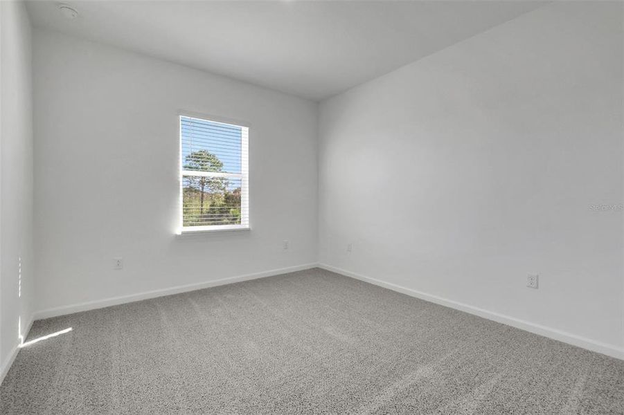 Spacious, unfurnished interior of a new home in Serenade at Ovation, Winter Garden (Image 21).