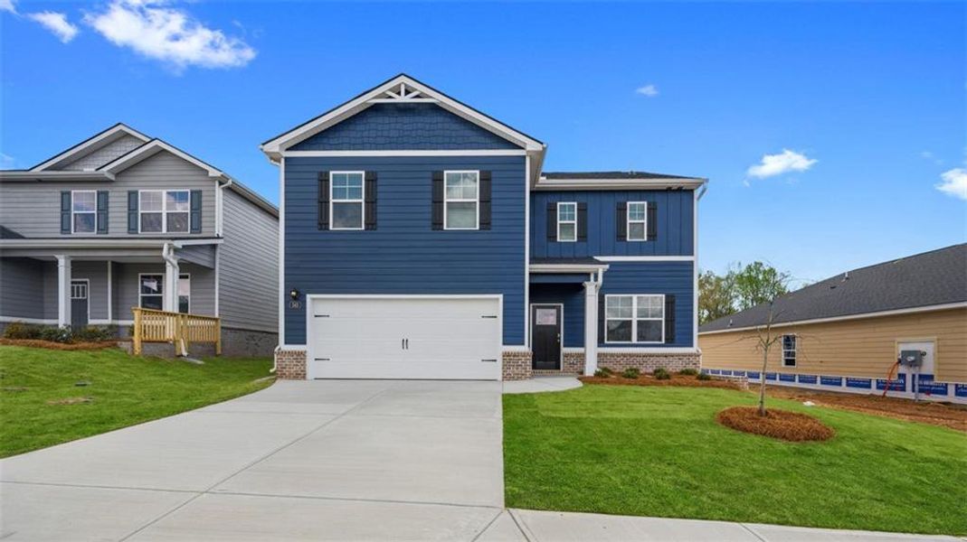 Front exterior of a new home in Twin Lakes, Hoschton, GA, highlighting curb appeal (Image 2).