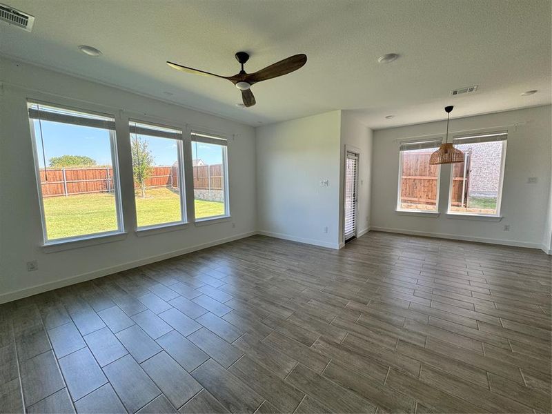 Living room with wood tiled floors and ceiling fan Living room with wood tiled floors and ceiling fan