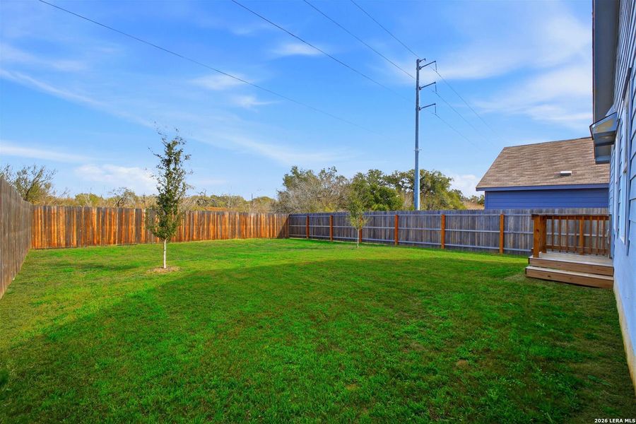 Exterior details and patio area of a home in Lodi Grove, Floresville (Image 24).