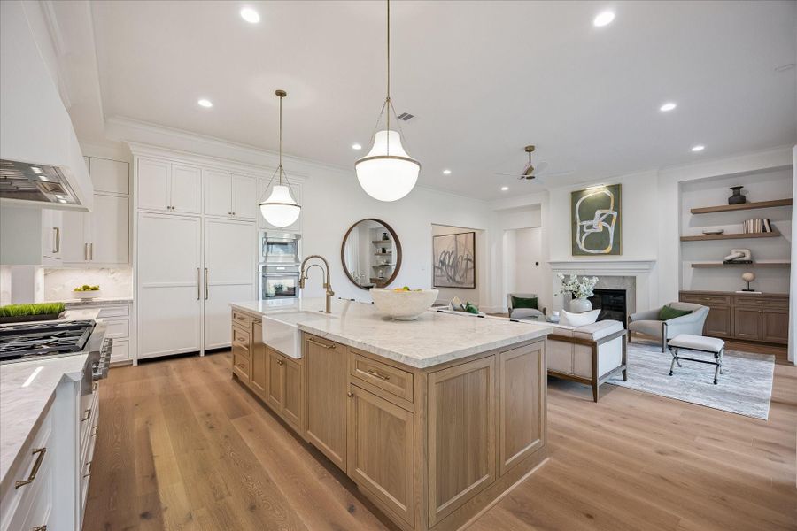 Thermador appliances, cabinet front fridge/freezer, apron front sink, wide plank wood floors