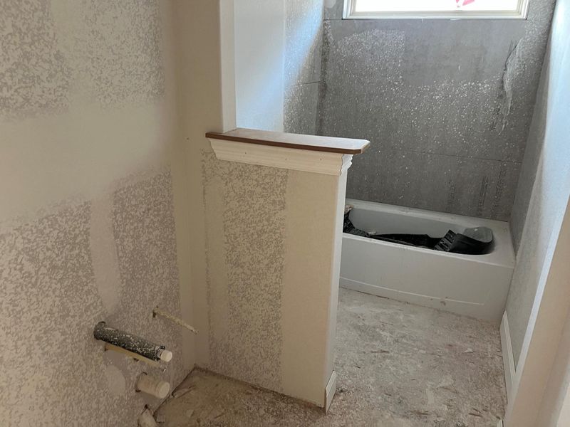 Full bath featuring a tub to relax in Full bath featuring a tub to relax in