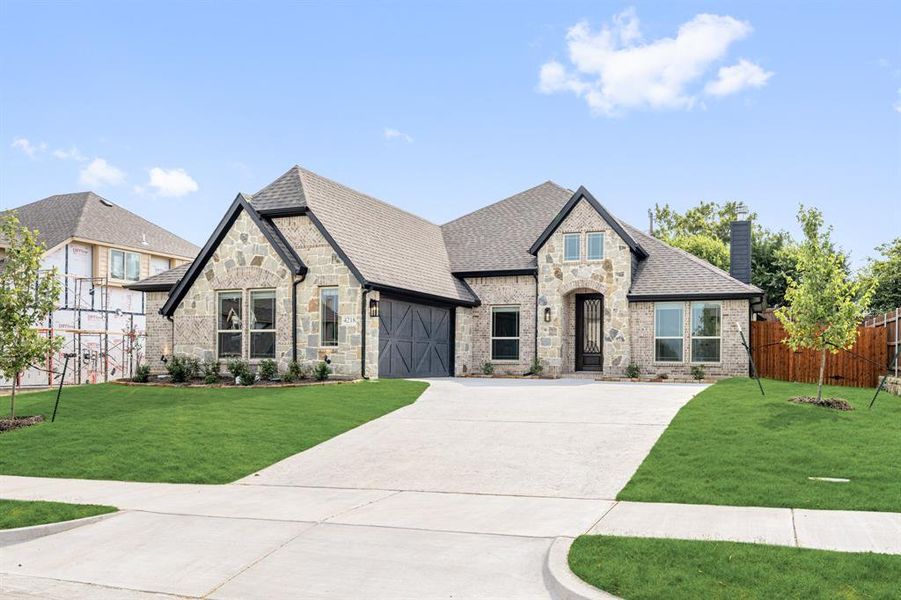 Front exterior of a new home in Ridgepoint, Midlothian, TX, highlighting curb appeal (Image 2).