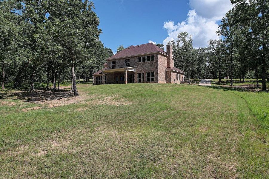 Front exterior of a new home in , Malakoff, TX, highlighting curb appeal (Image 1). Front exterior of a new home in , Malakoff, TX, highlighting curb appeal (Image 1).