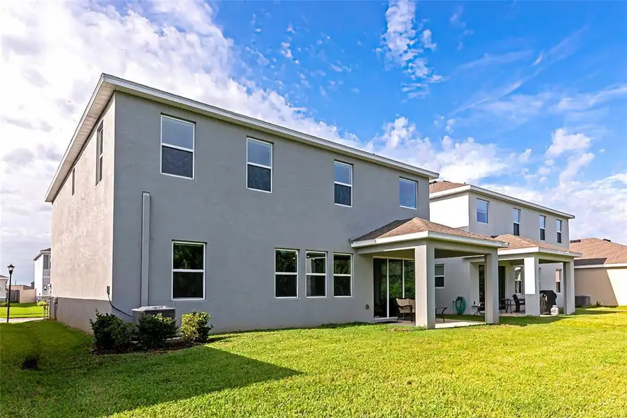 Front exterior of a new home in , Apollo Beach, FL, highlighting curb appeal (Image 22).