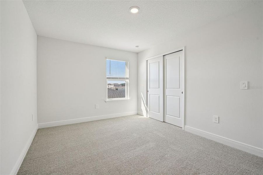 Spacious, unfurnished interior of a new home in The Reserve at Hammock Oaks - Signature Series, Lady Lake (Image 34).