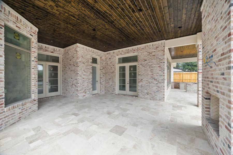 Progress photo from December 2025 - covered patio with outdoor kitchen