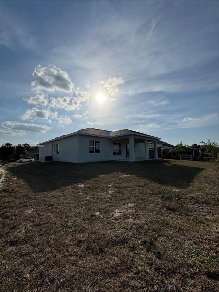 Front exterior of a new home in , Labelle, FL, highlighting curb appeal (Image 16).