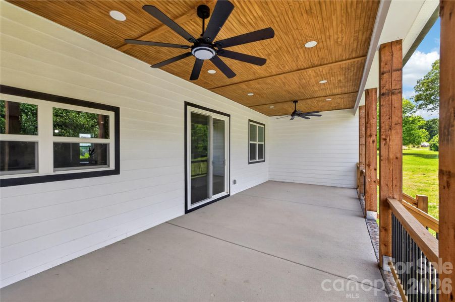 This is the kind of porch you actually use year-round. Morning coffee, football Sundays, family cookouts, quiet nights outside — there’s room for all of it here
