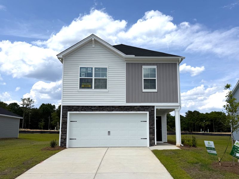 Front exterior of a new home in Reserve at Mill Creek, Columbia, SC, highlighting curb appeal (Image 2). Front exterior of a new home in Reserve at Mill Creek, Columbia, SC, highlighting curb appeal (Image 2).