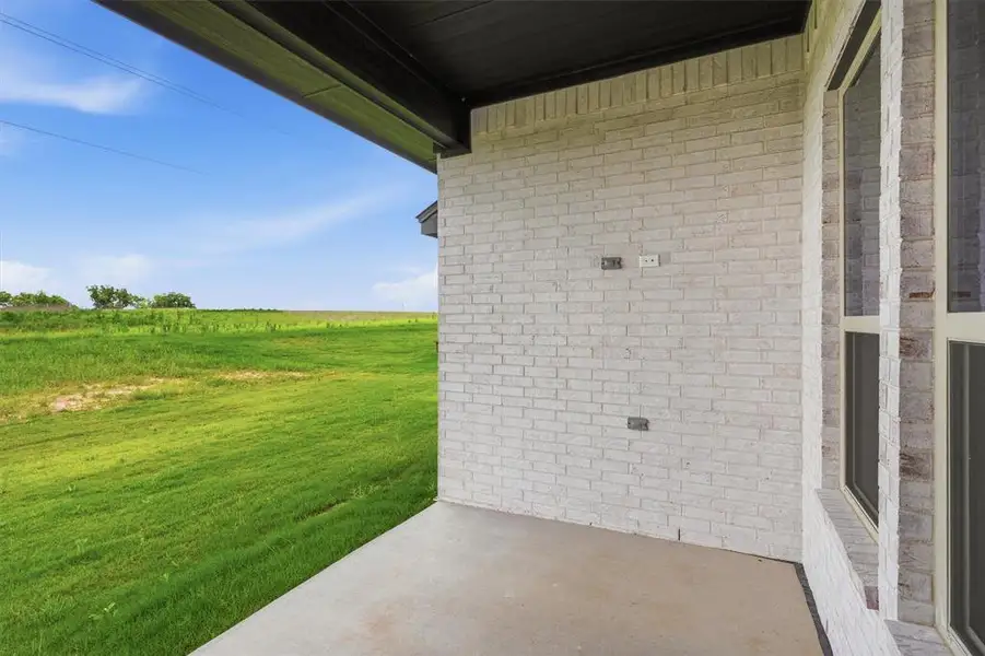 Exterior details and patio area of a home in , Tolar (Image 22).