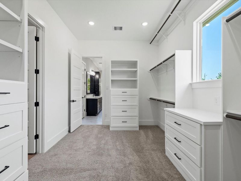 Another view of Primary closet with built-ins. Another view of Primary closet with built-ins.