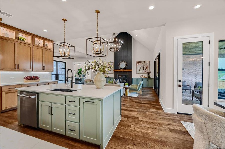 Oversized island with pendant lights, granite composite sink