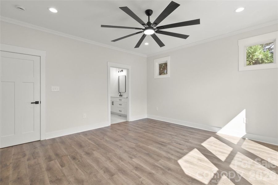 Another view of primary bedroom