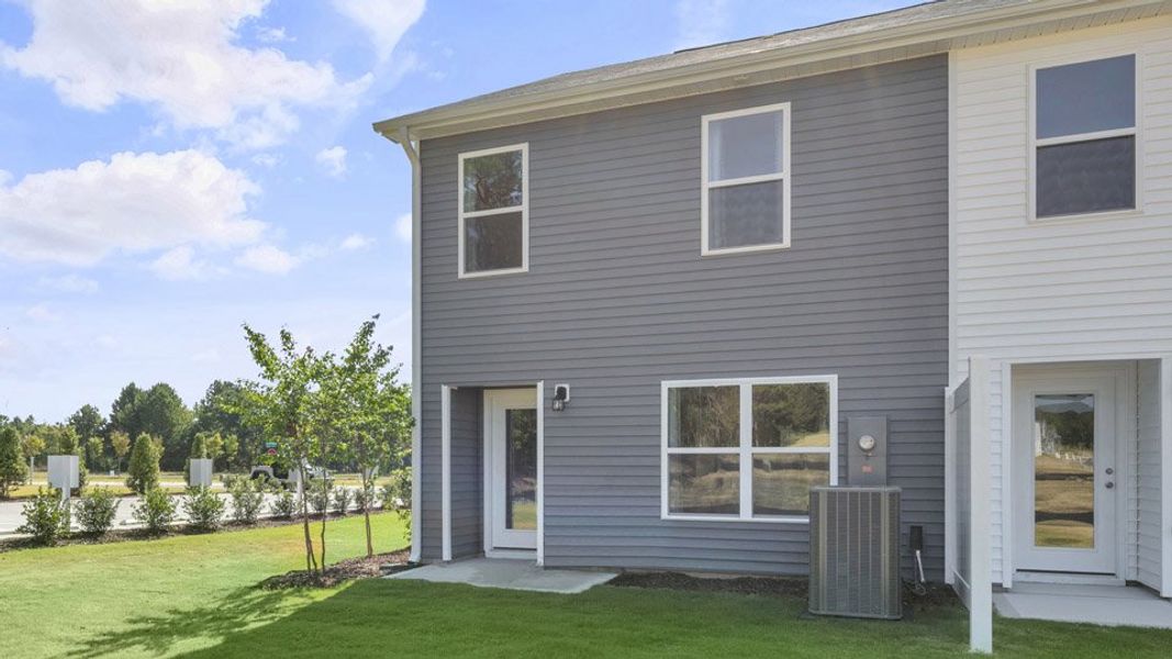 Exterior details and patio area of a home in The Townes at Ridgewood Farms, Winterville (Image 26).