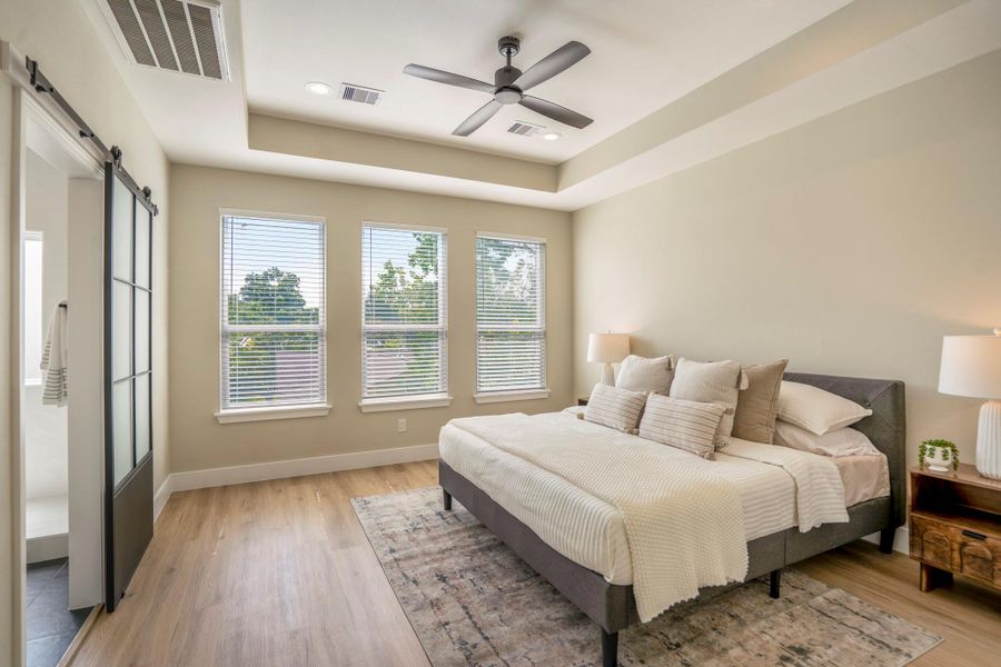 Primary bedroom with recessed ceilings Primary bedroom with recessed ceilings