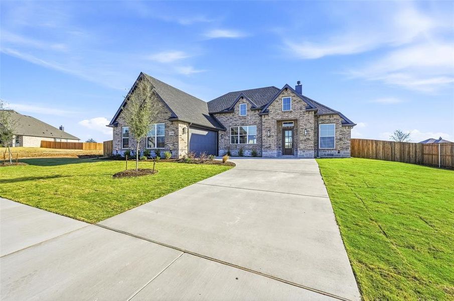 Front exterior of a new home in Coyote Crossing, Godley, TX, highlighting curb appeal (Image 1). Front exterior of a new home in Coyote Crossing, Godley, TX, highlighting curb appeal (Image 1).