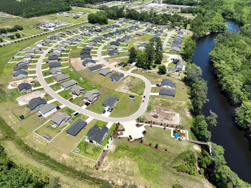 Aerial overview of property's location with a nearby body of water