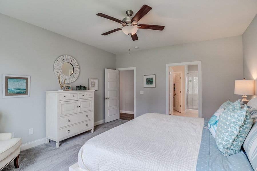 Representative furnished interior of a home built from the The Amherst by RobuckHomes in Windwater, Hampstead (Image 14).