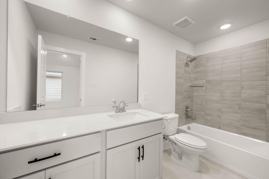 Furnished interior view inside a new home in Cottage Collection at Harvest, Argyle (Image 10).