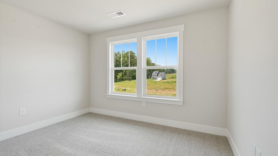 Refined bedroom design with large windows for daylight-filled mornings and peaceful views at Harrier Point Refined bedroom design with large windows for daylight-filled mornings and peaceful views at Harrier Point