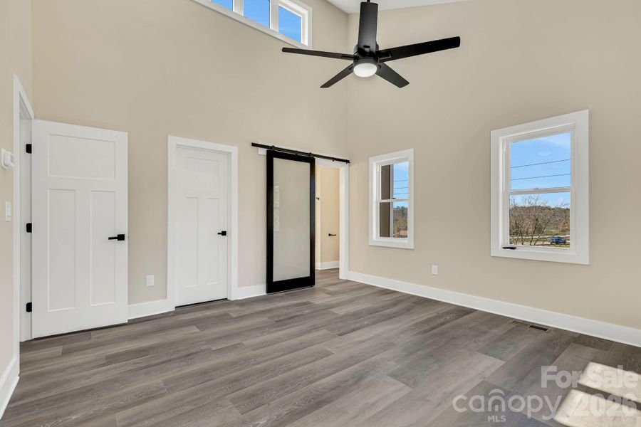 Master suite with expansive cathedral ceilings and tons of accent windows
