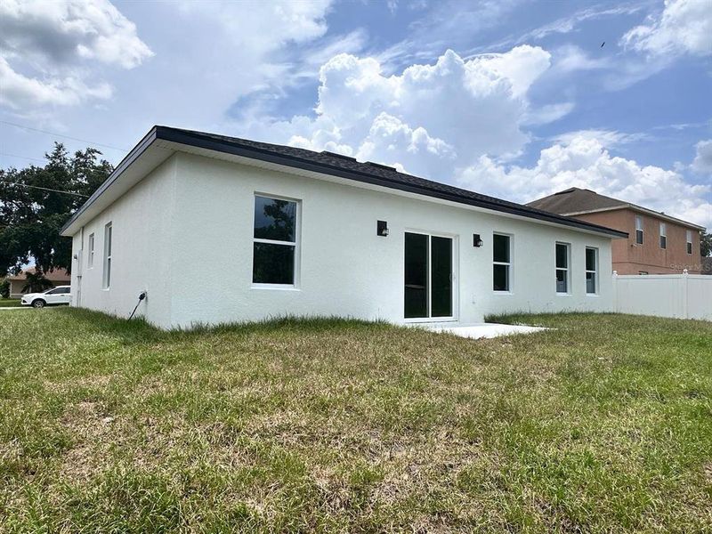 Front exterior of a new home in , Poinciana, FL, highlighting curb appeal (Image 20). Front exterior of a new home in , Poinciana, FL, highlighting curb appeal (Image 20).