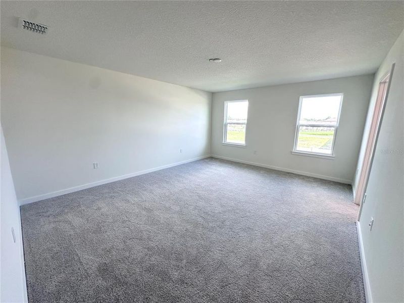 Spacious, unfurnished interior of a new home in Grasslands West, Lakeland (Image 28).