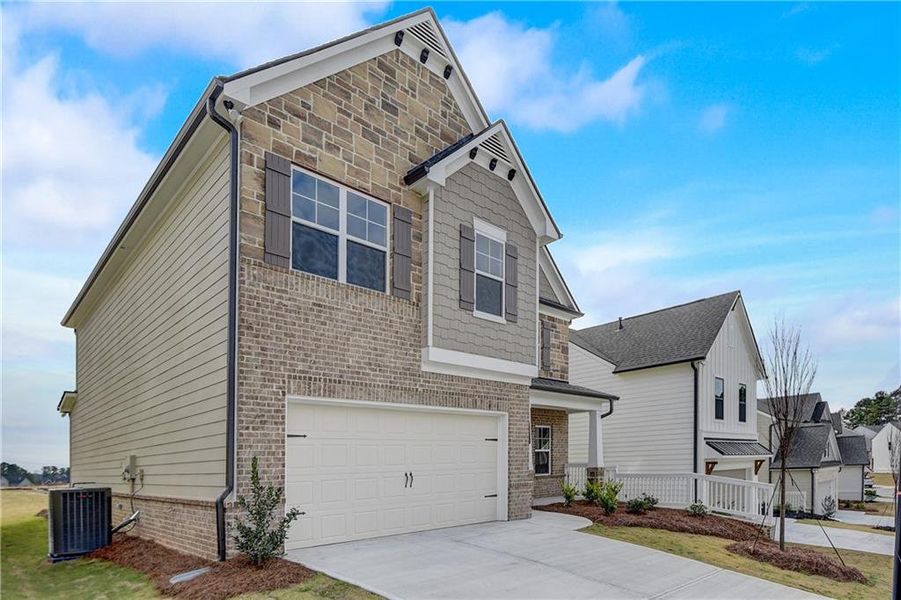 Front exterior of a new home in Summerlin, Winder, GA, highlighting curb appeal (Image 23). Front exterior of a new home in Summerlin, Winder, GA, highlighting curb appeal (Image 23).